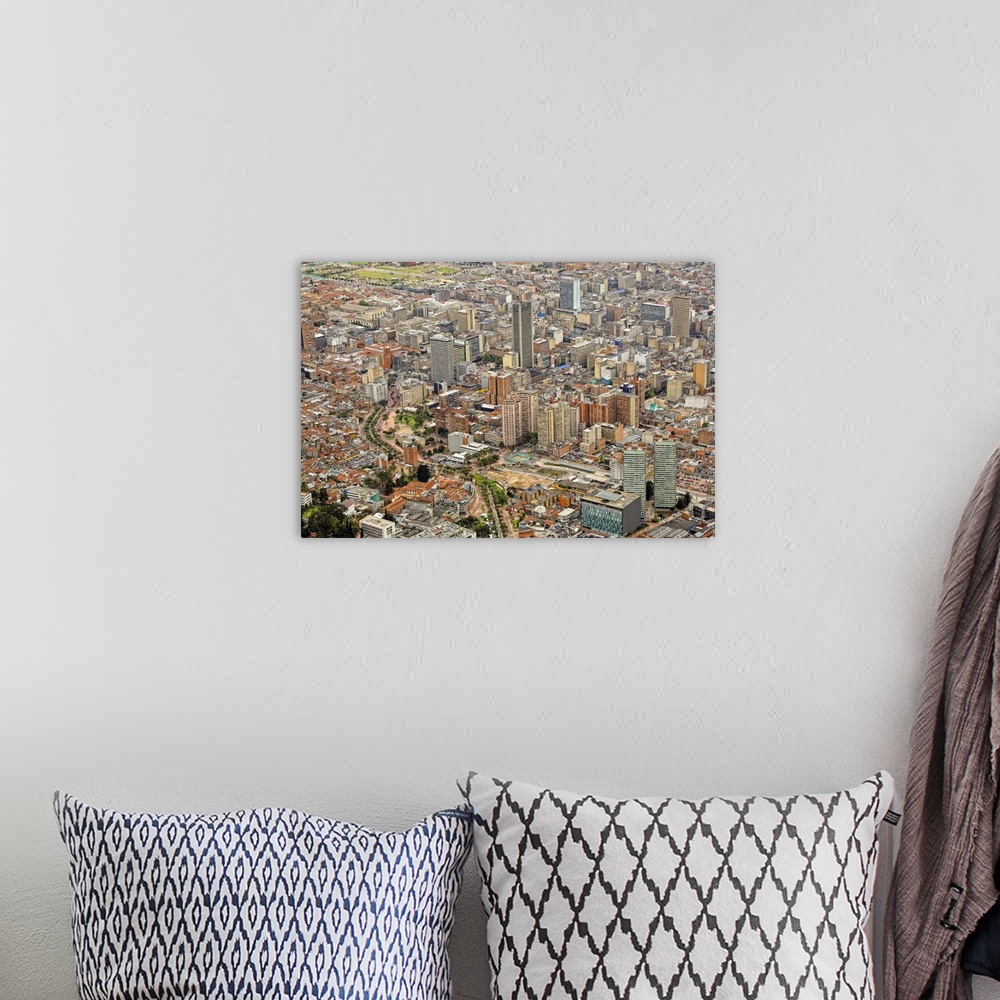 A bohemian room featuring Aerial view of modern area of Bogota City with many high-rise buildings.