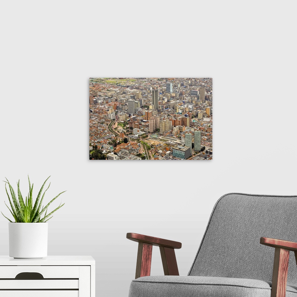 A modern room featuring Aerial view of modern area of Bogota City with many high-rise buildings.
