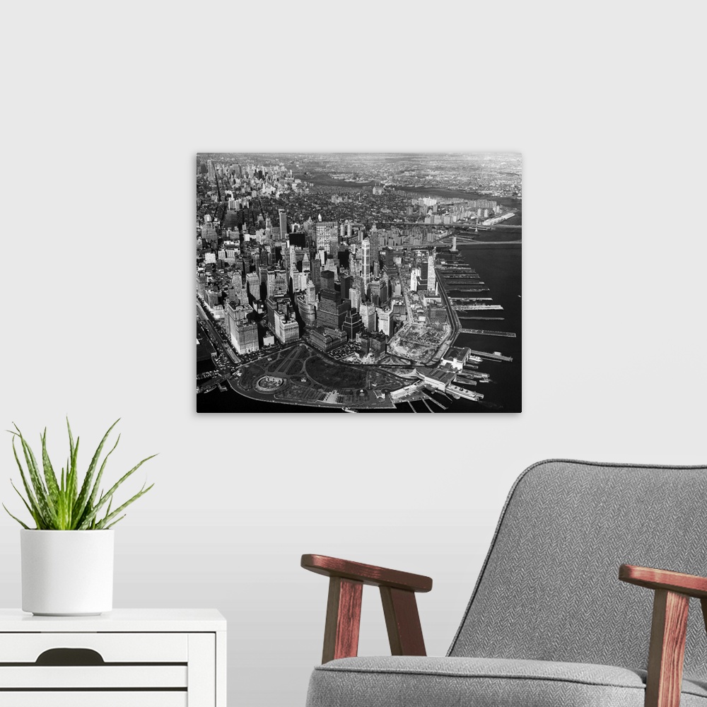 A modern room featuring Photo shows an aerial view of New York City's skyline.