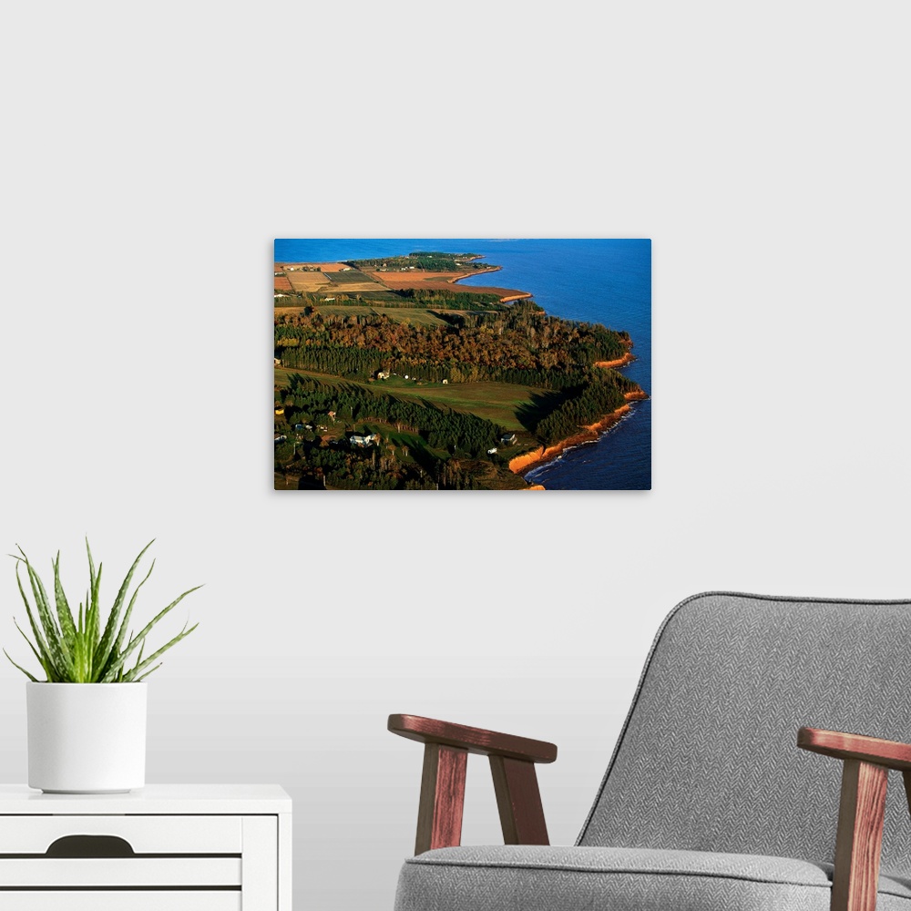 A modern room featuring An aerial view of western coastline of PEI on an autumn afternoon.