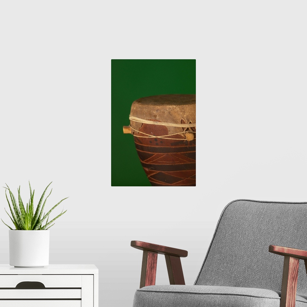 A modern room featuring African drum on green backgound