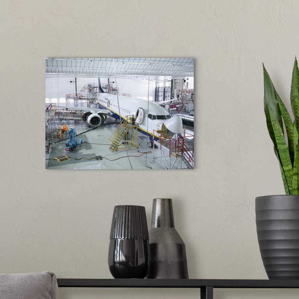 A modern room featuring Airplane built in a hangar