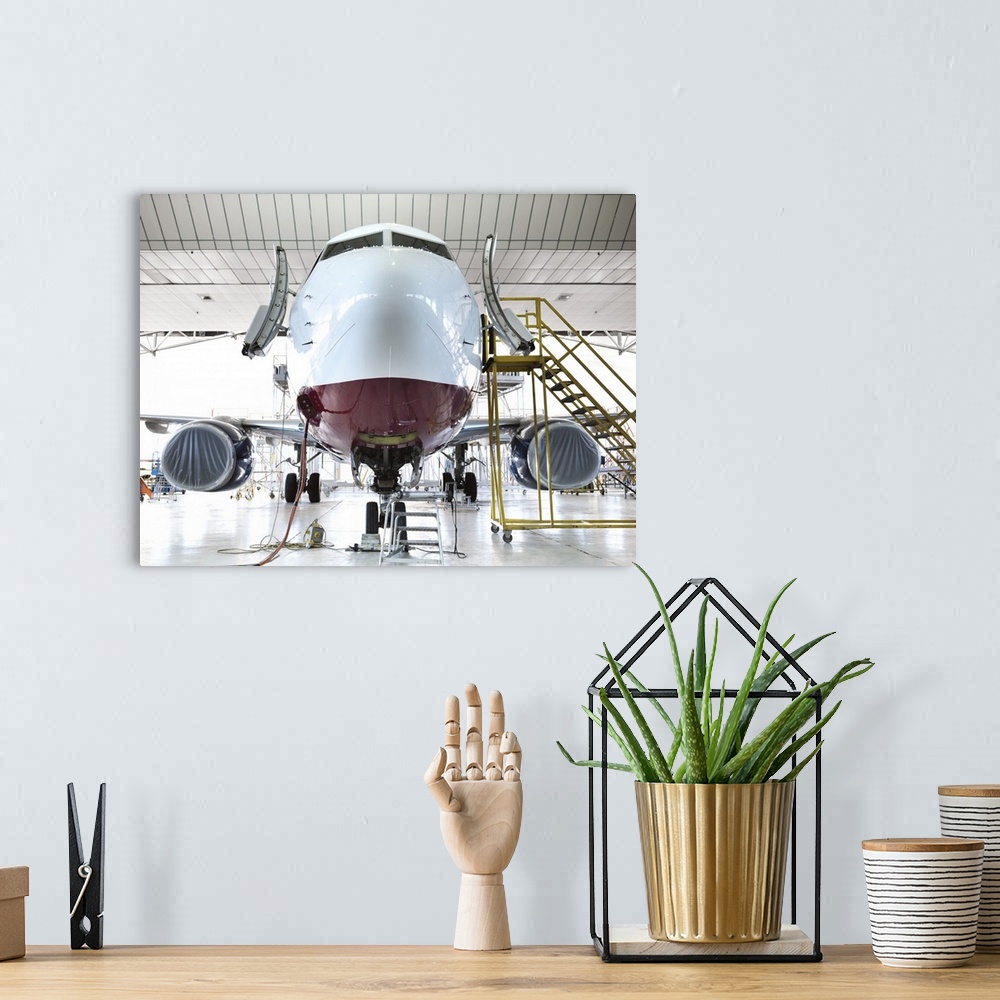 A bohemian room featuring Airplane docked in hangar
