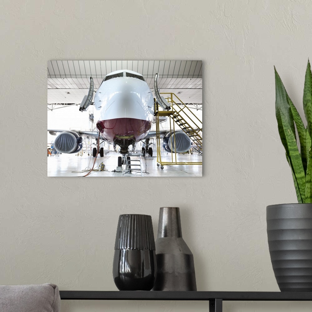 A modern room featuring Airplane docked in hangar