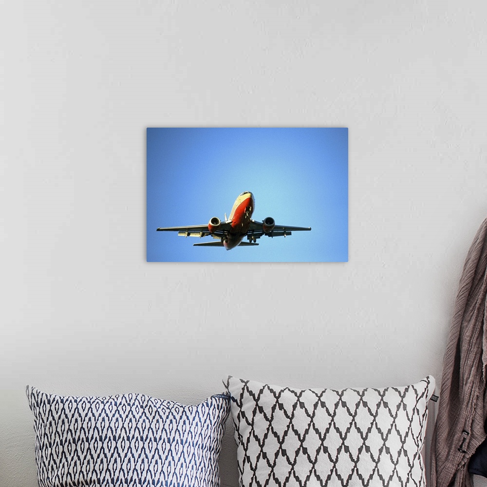 A bohemian room featuring airplane in blue sky