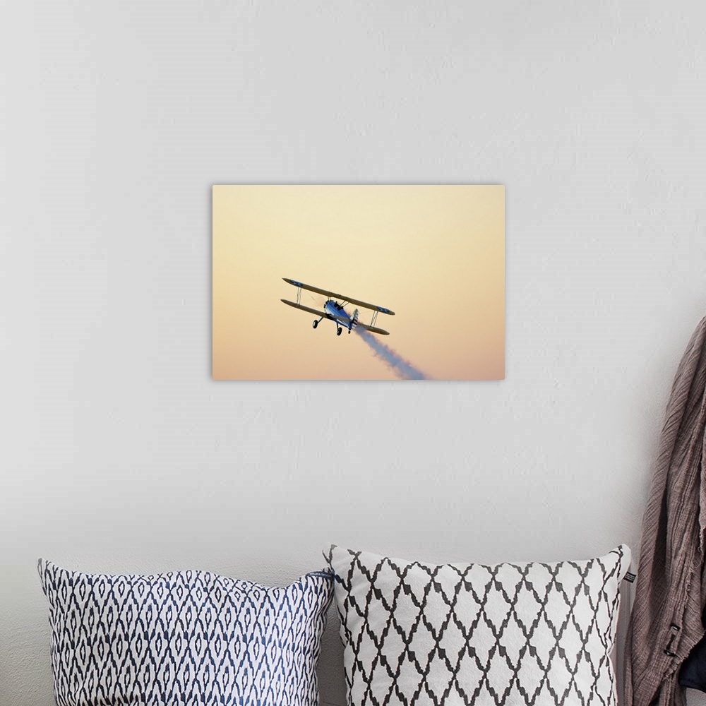 A bohemian room featuring Airshow smoke trail at sunset.