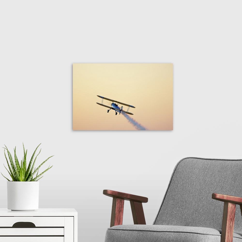 A modern room featuring Airshow smoke trail at sunset.