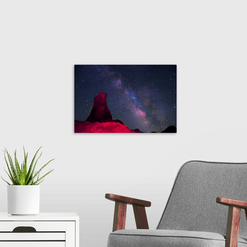 A modern room featuring Night at Alabama hills, rock tower light painted with red light with stars and Milky way in sky b...