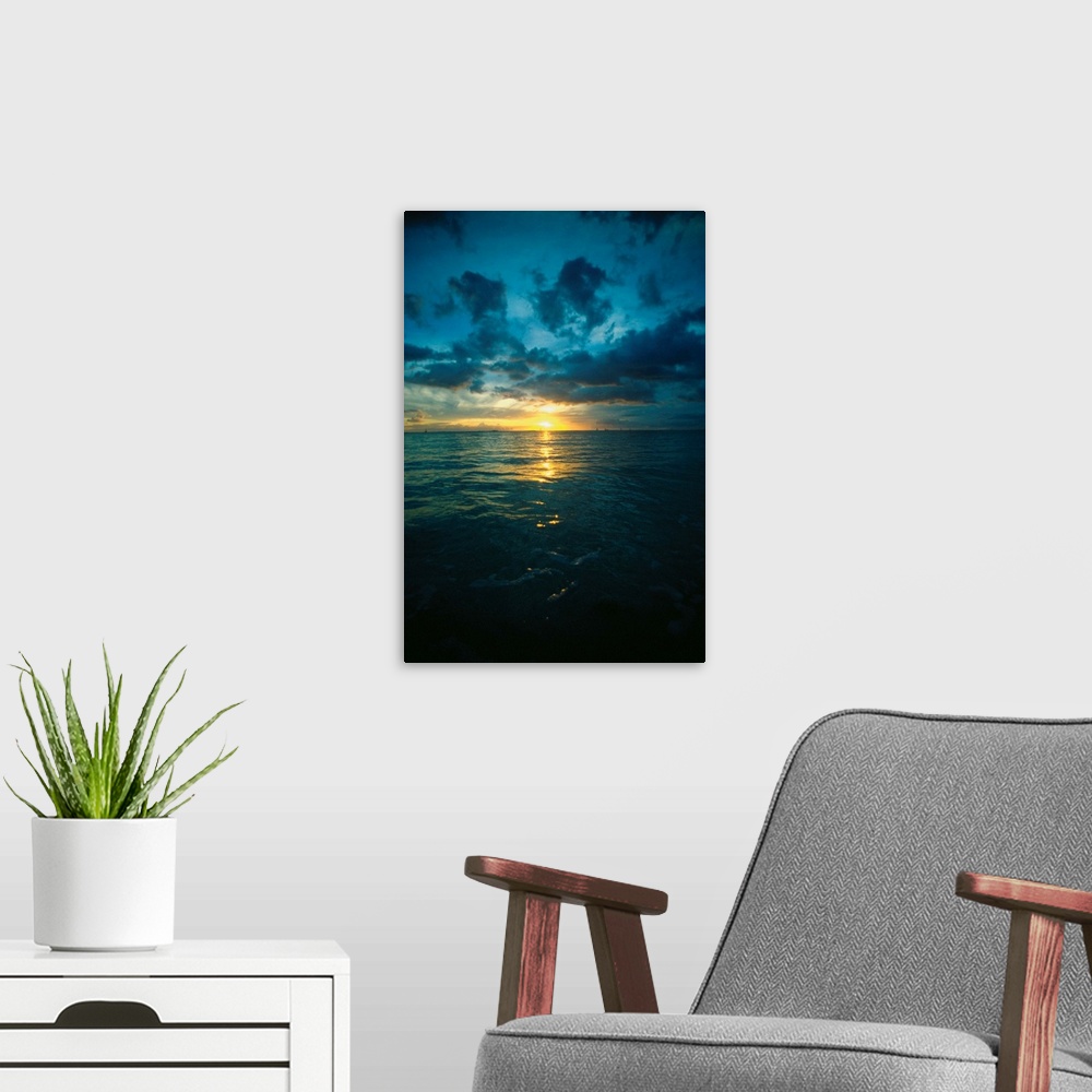 A modern room featuring Altostratus clouds over the ocean at sunset