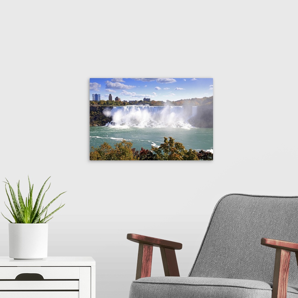 A modern room featuring American Falls at Niagara Falls. View south to Buffalo and the USA from Canada.