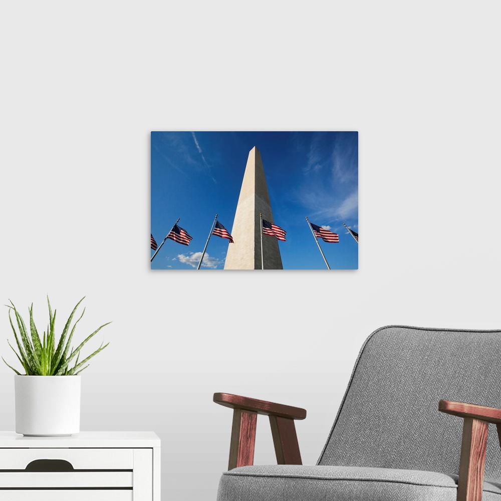 A modern room featuring Low angle view of American flags at base of Washington Monument at sunset on summer evening, Wash...