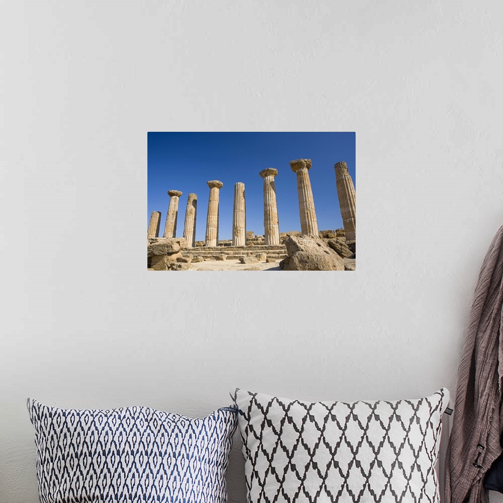 A bohemian room featuring Ancient ruins of columns