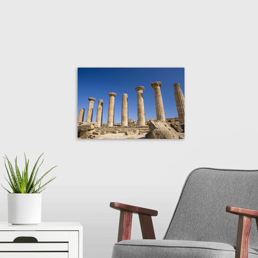 A modern room featuring Ancient ruins of columns