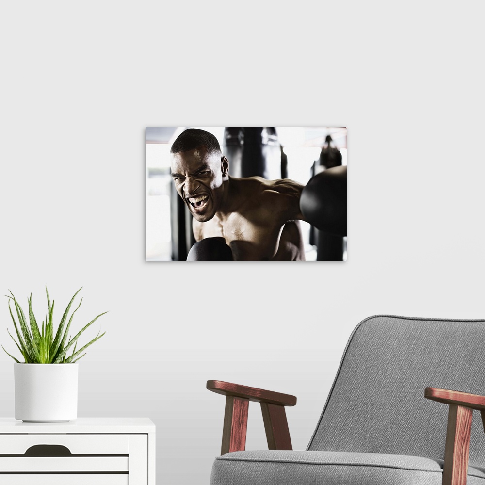 A modern room featuring Angry man boxing