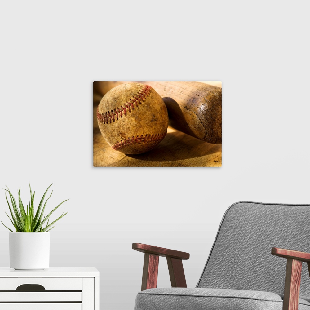 A modern room featuring Distressed baseball and bat in this horizontal photograph.