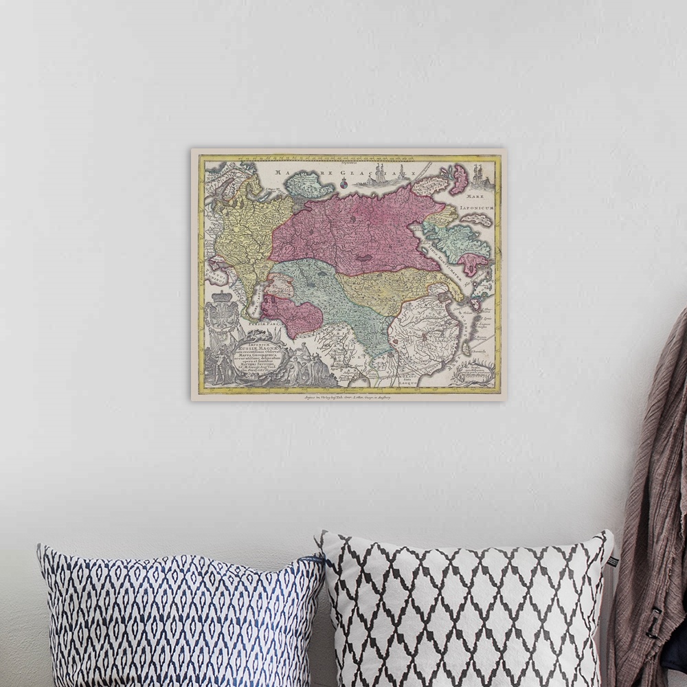 A bohemian room featuring An antique map of Eurasia with countries highlighted in colors.