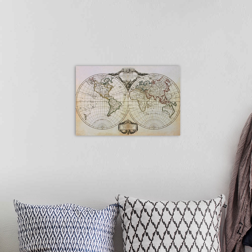 A bohemian room featuring An antique map of the world showing one half in a circle and the other half in another circle jus...