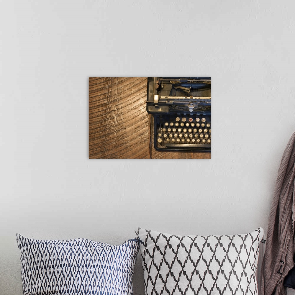 A bohemian room featuring Antique typewriter on wooden surface