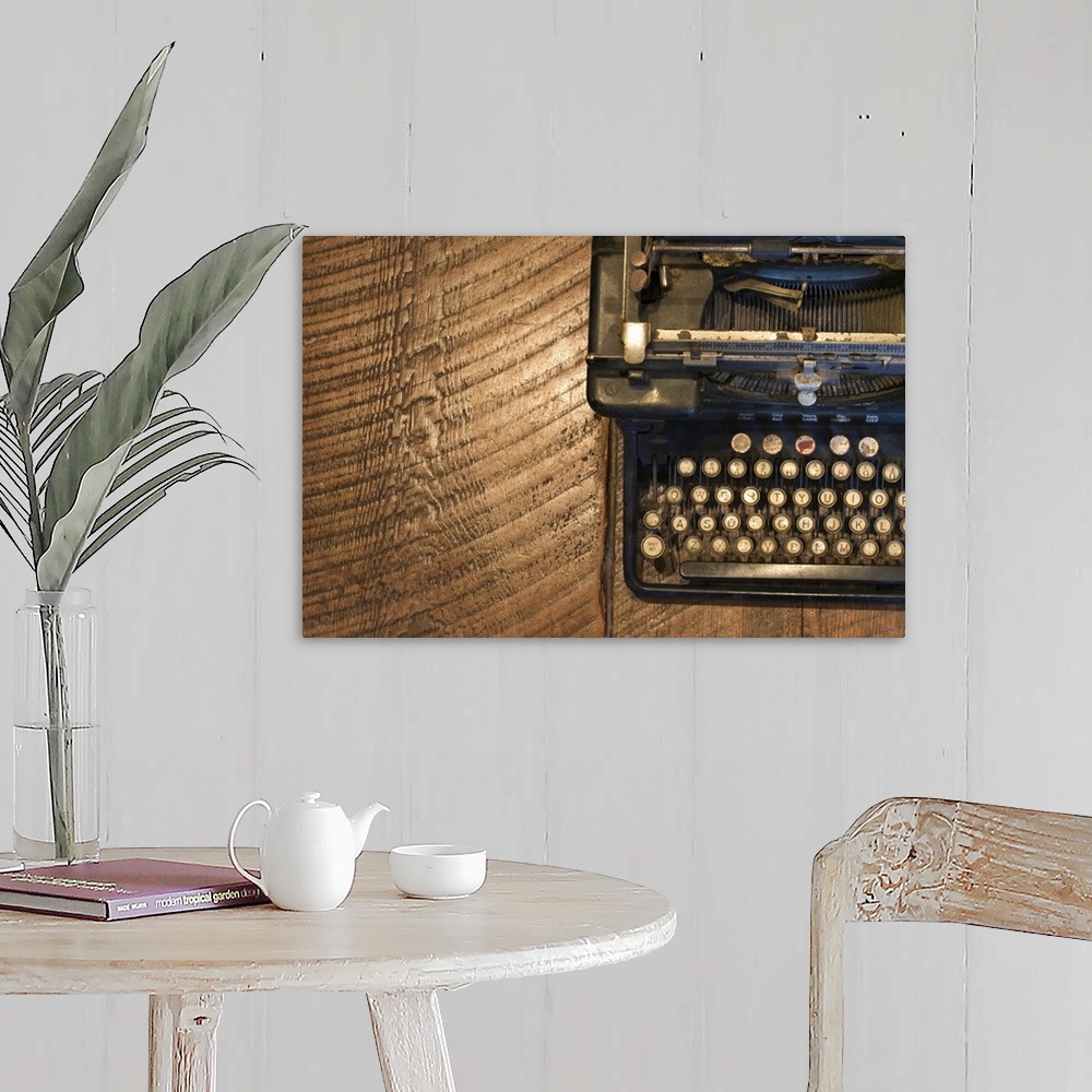 A farmhouse room featuring Antique typewriter on wooden surface