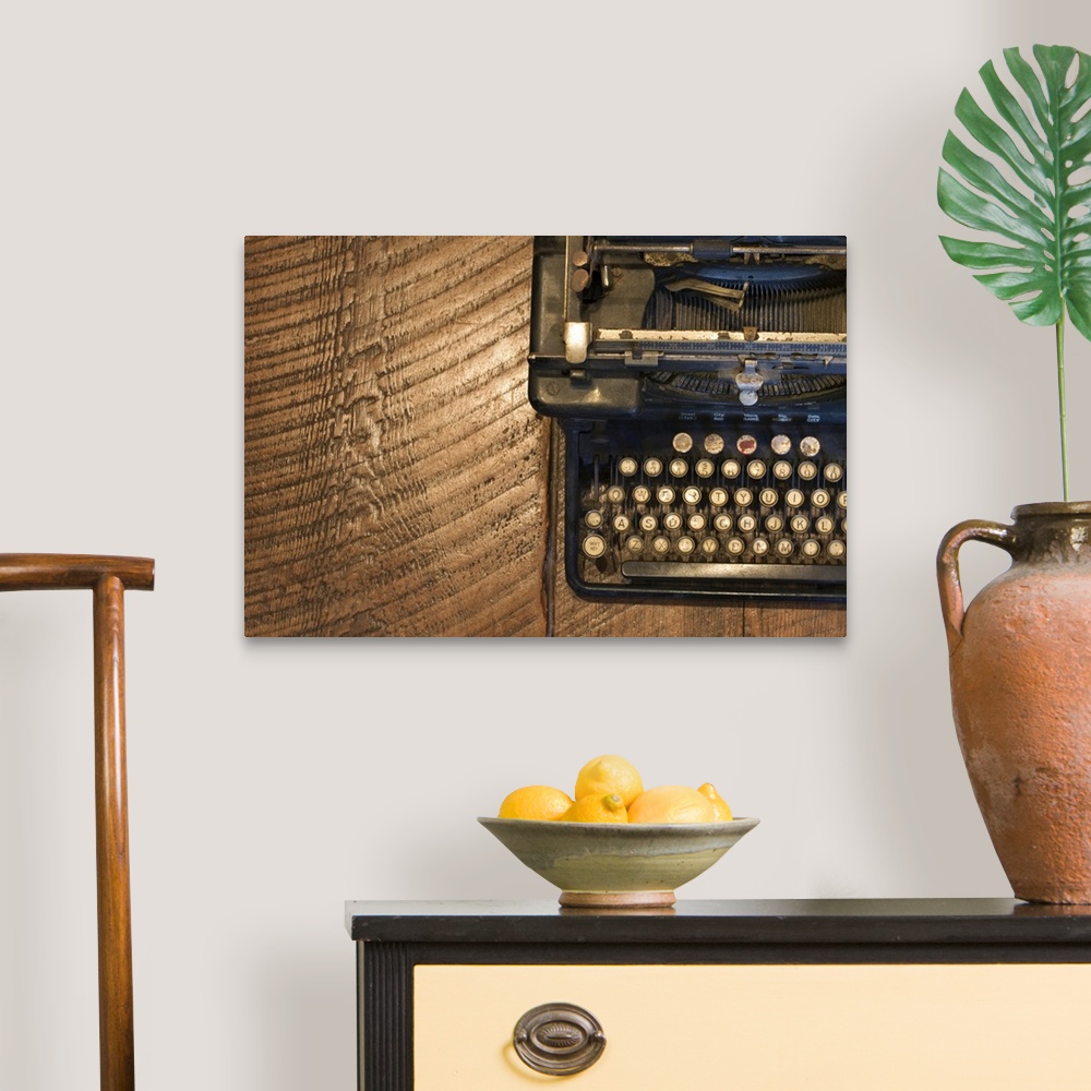 A traditional room featuring Antique typewriter on wooden surface