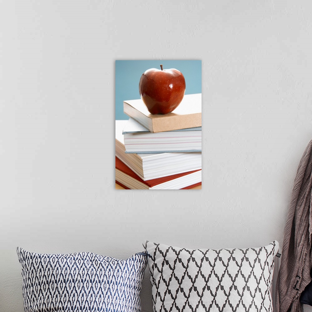 A bohemian room featuring Apple on textbooks