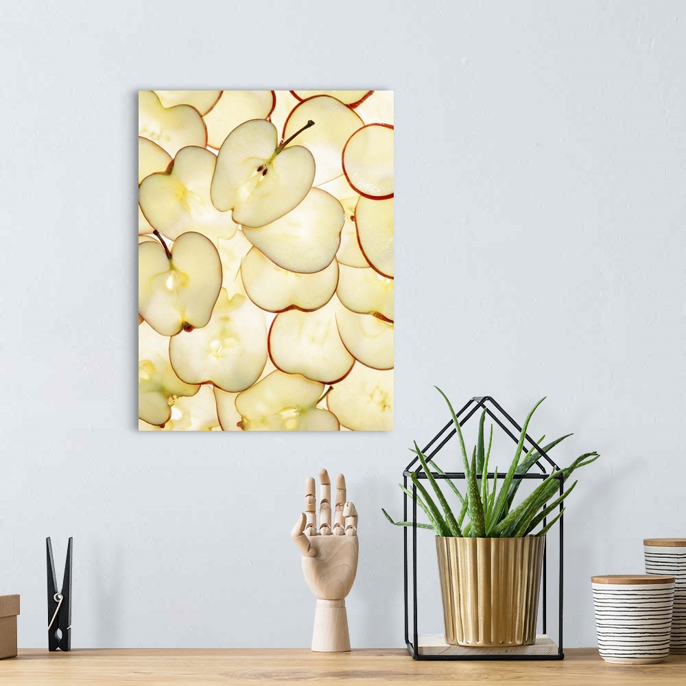 A bohemian room featuring Apple slices backlit and arranged in abstract graphic pattern