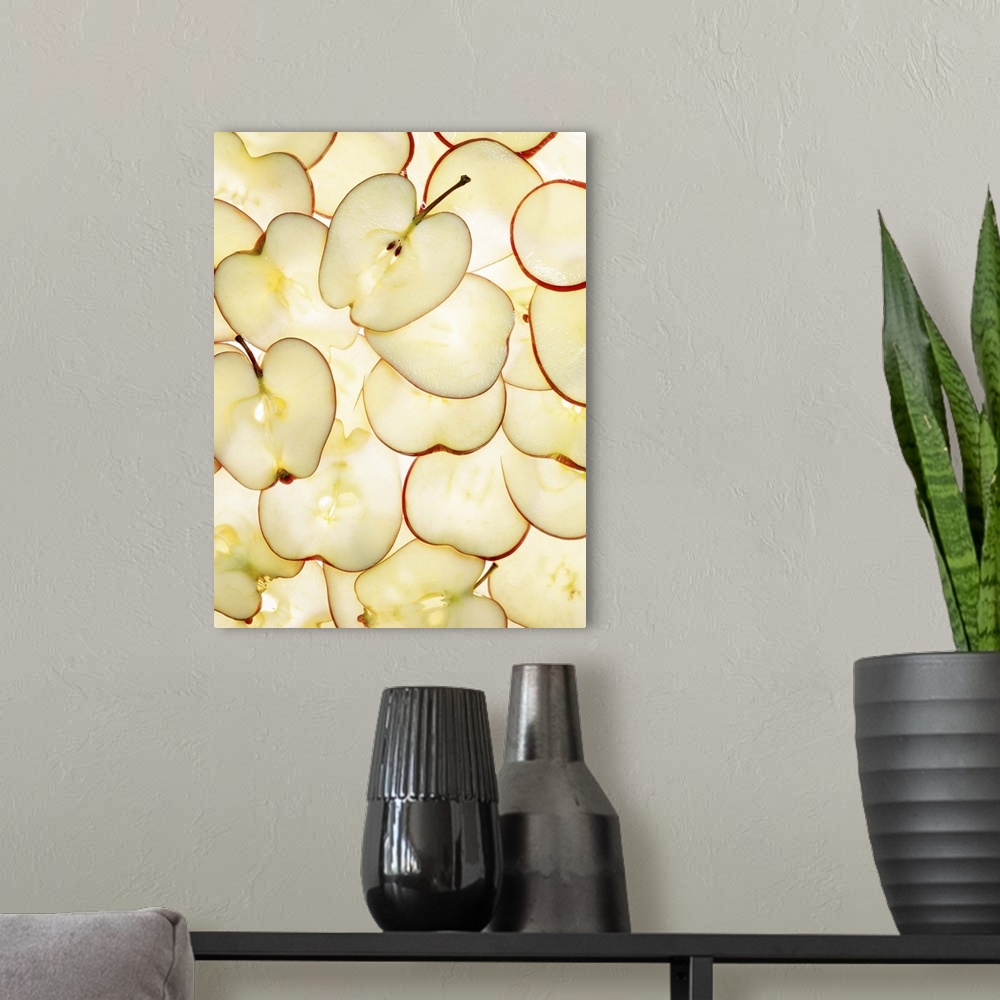 A modern room featuring Apple slices backlit and arranged in abstract graphic pattern
