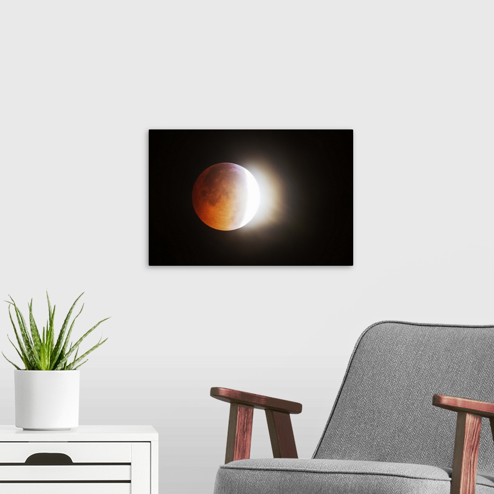 A modern room featuring Approching the Total Eclipse of the Moon