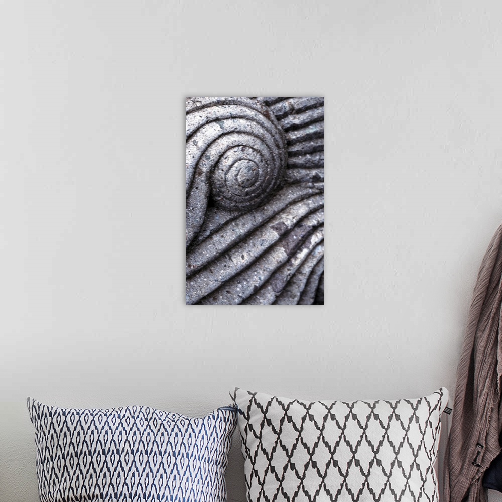 A bohemian room featuring Very closely taken photograph of a piece of architecture that has ridges and swirls.
