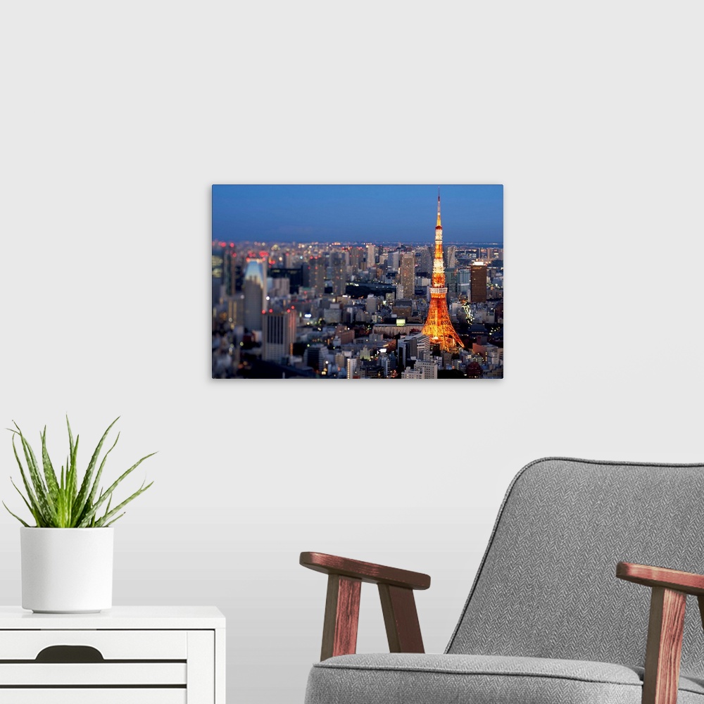 A modern room featuring Arial view of Tokyo at dusk sign on illuminated Tokyo Tower.