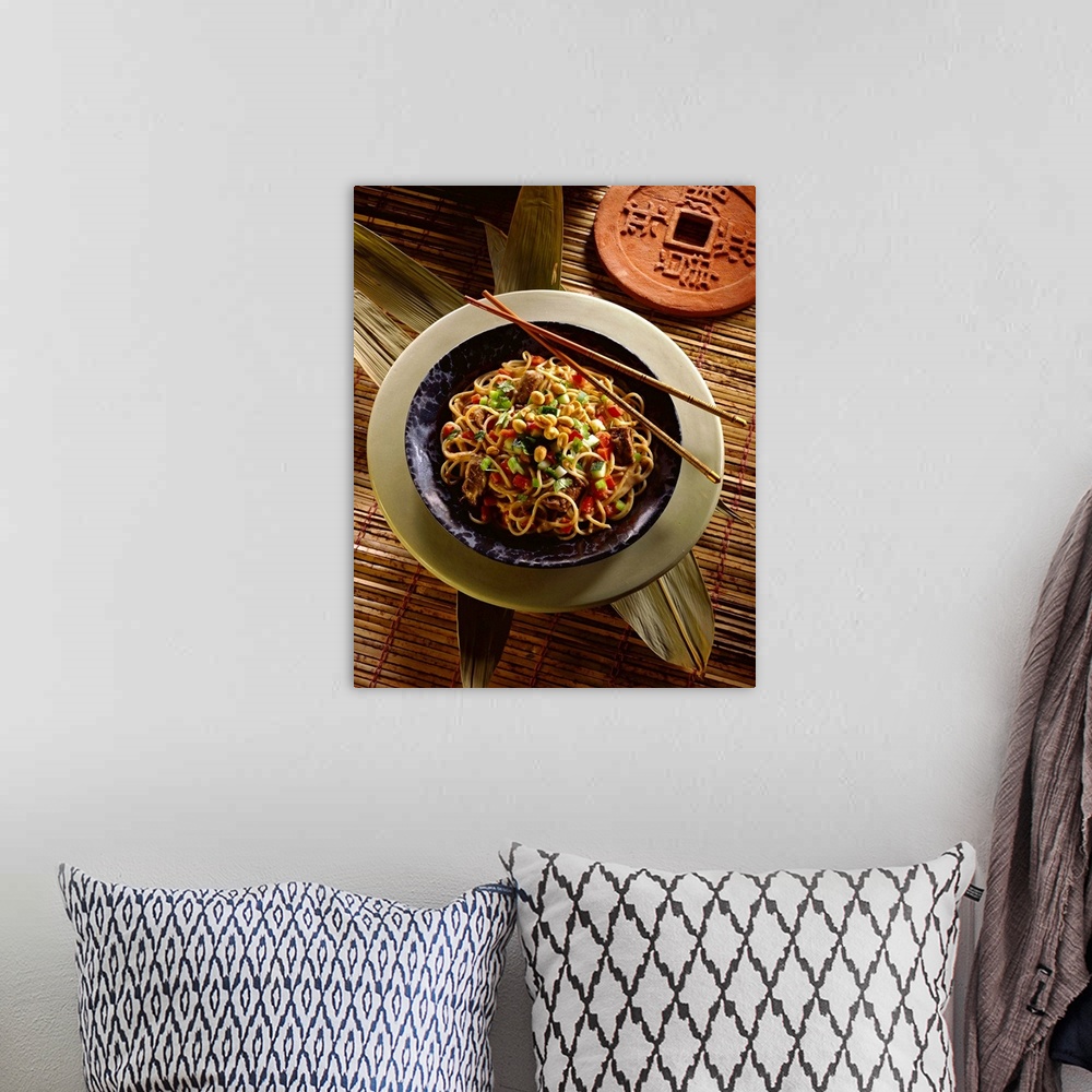 A bohemian room featuring Asian noodles with beef and peanuts