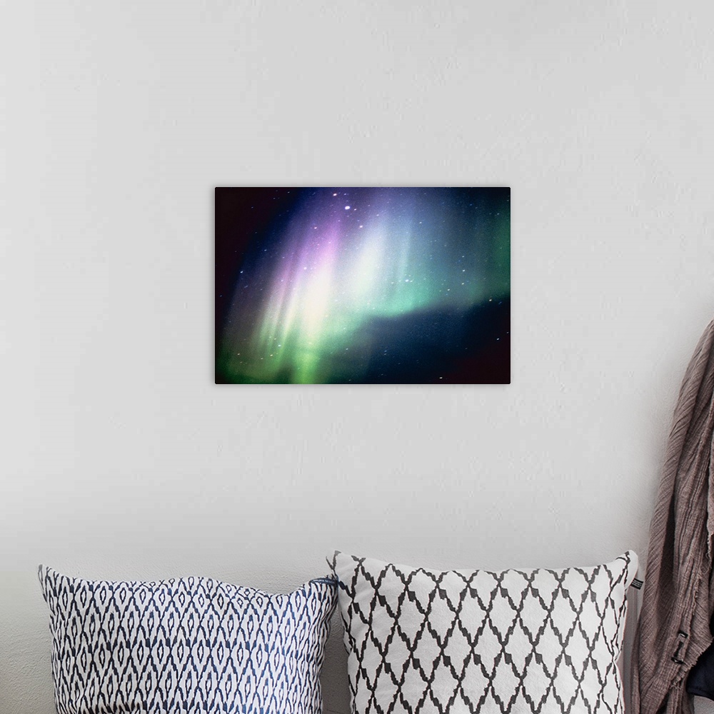 A bohemian room featuring Aurora borealis