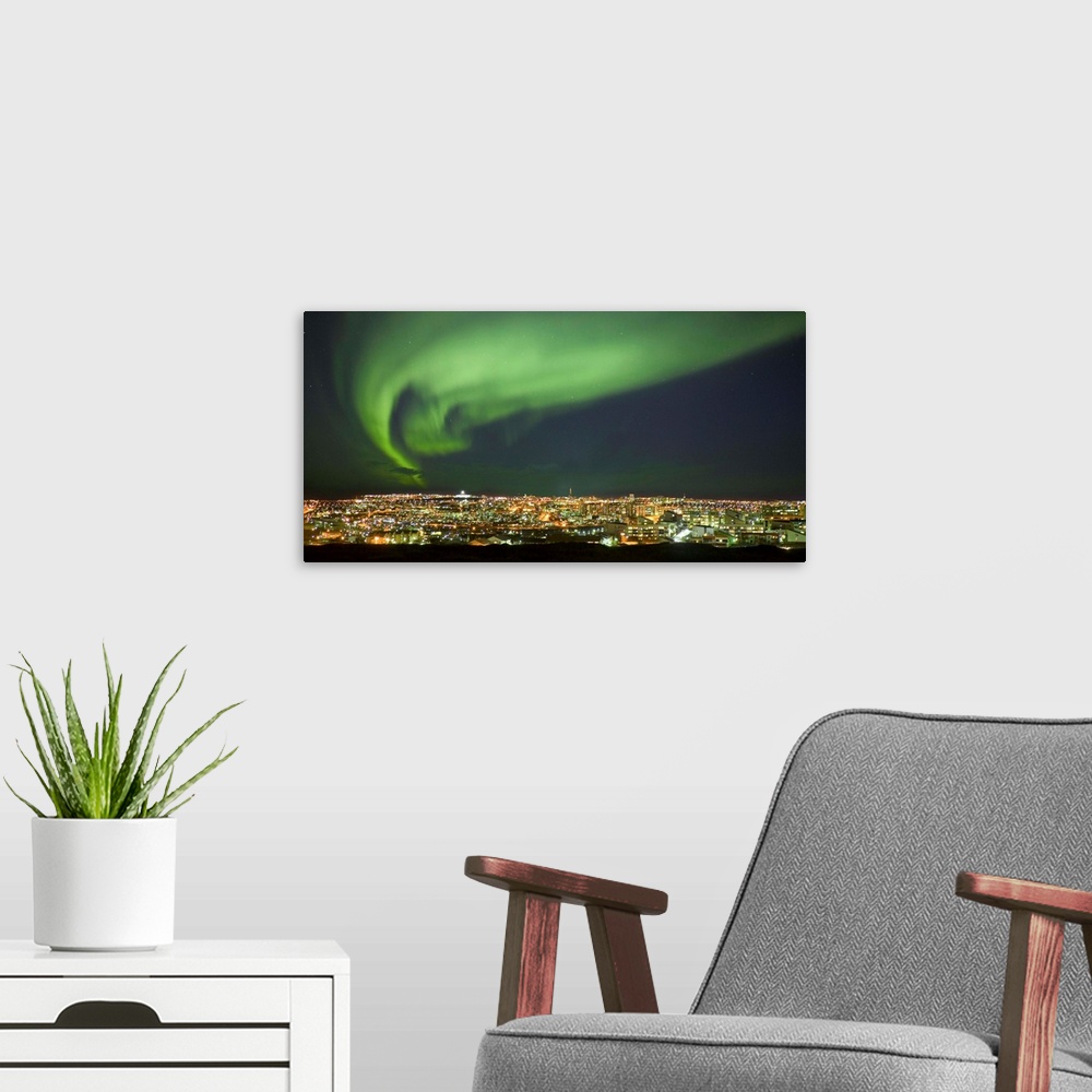 A modern room featuring Aurora Borealis Over Reykjavik