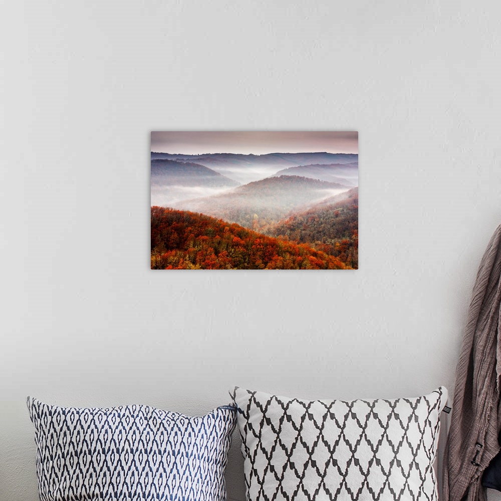 A bohemian room featuring Small patches of fog in mountain slopes