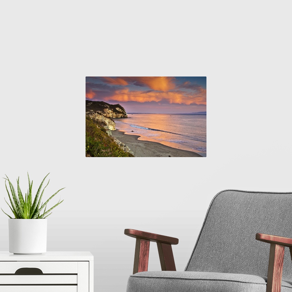 A modern room featuring Horizontal photograph on a big wall hanging of the rocky coast line along Avila Beach in Californ...
