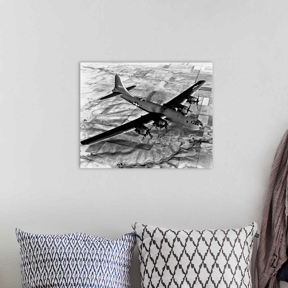 A bohemian room featuring Aerial view of a B-29 flying over Japanese fields.