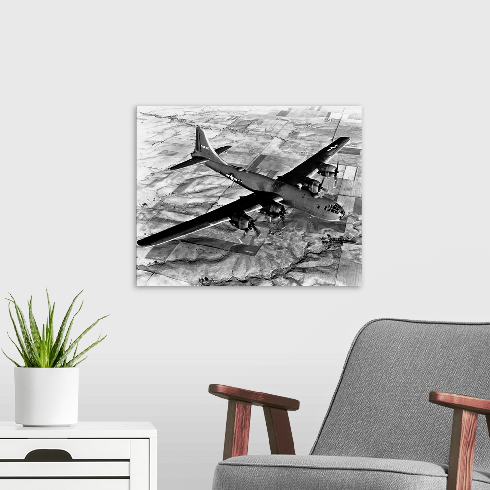 A modern room featuring Aerial view of a B-29 flying over Japanese fields.