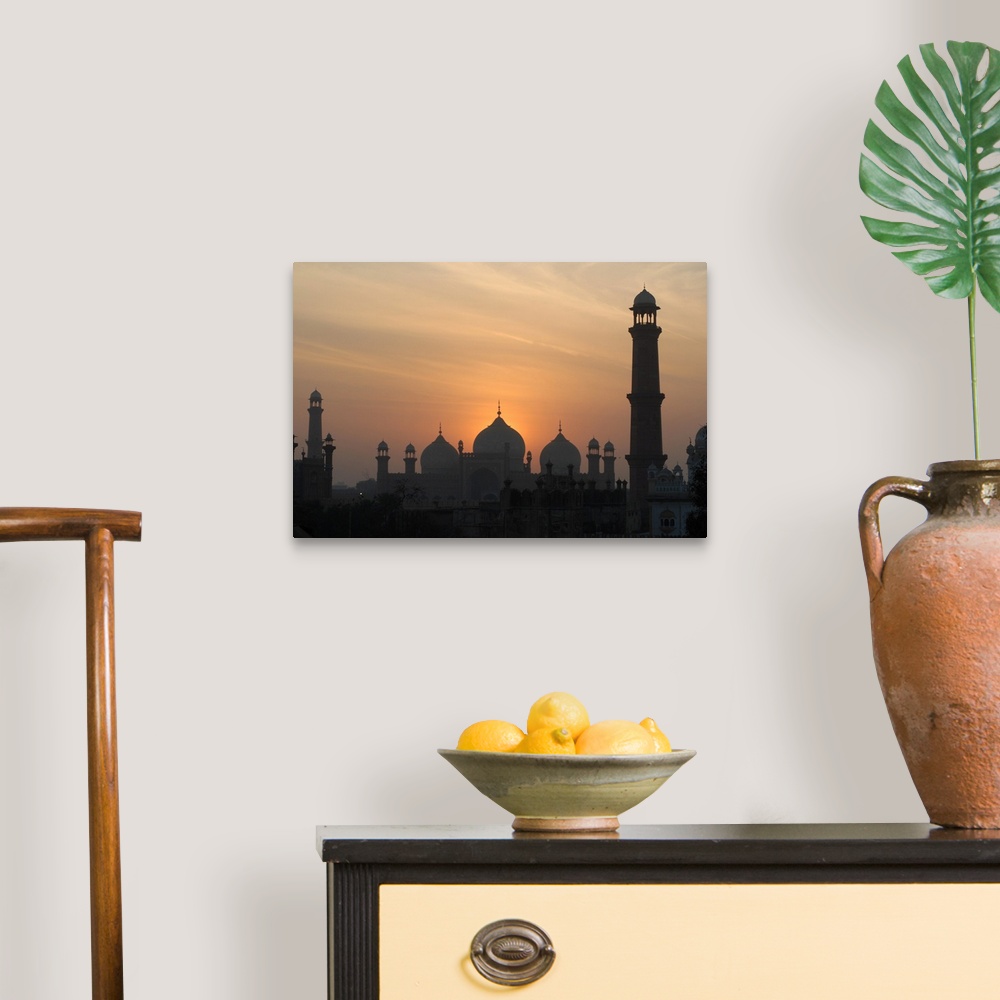 A traditional room featuring Badshahi Mosque at sunset, Lahore, Pakistan.