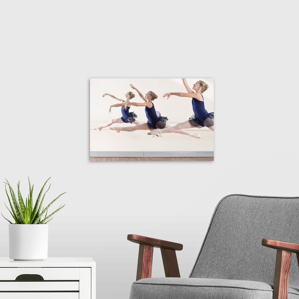 A modern room featuring Ballerinas leaping in midair