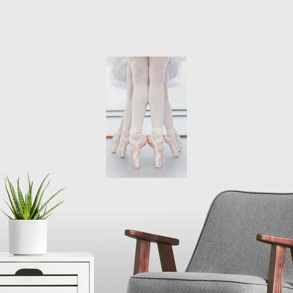 A modern room featuring Ballet dancersA feet on pointe