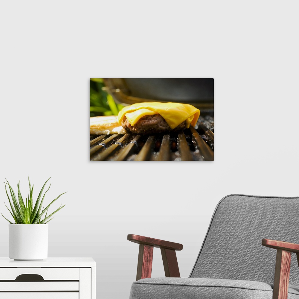 A modern room featuring Barbecue scene, cheeseburger on the grill.