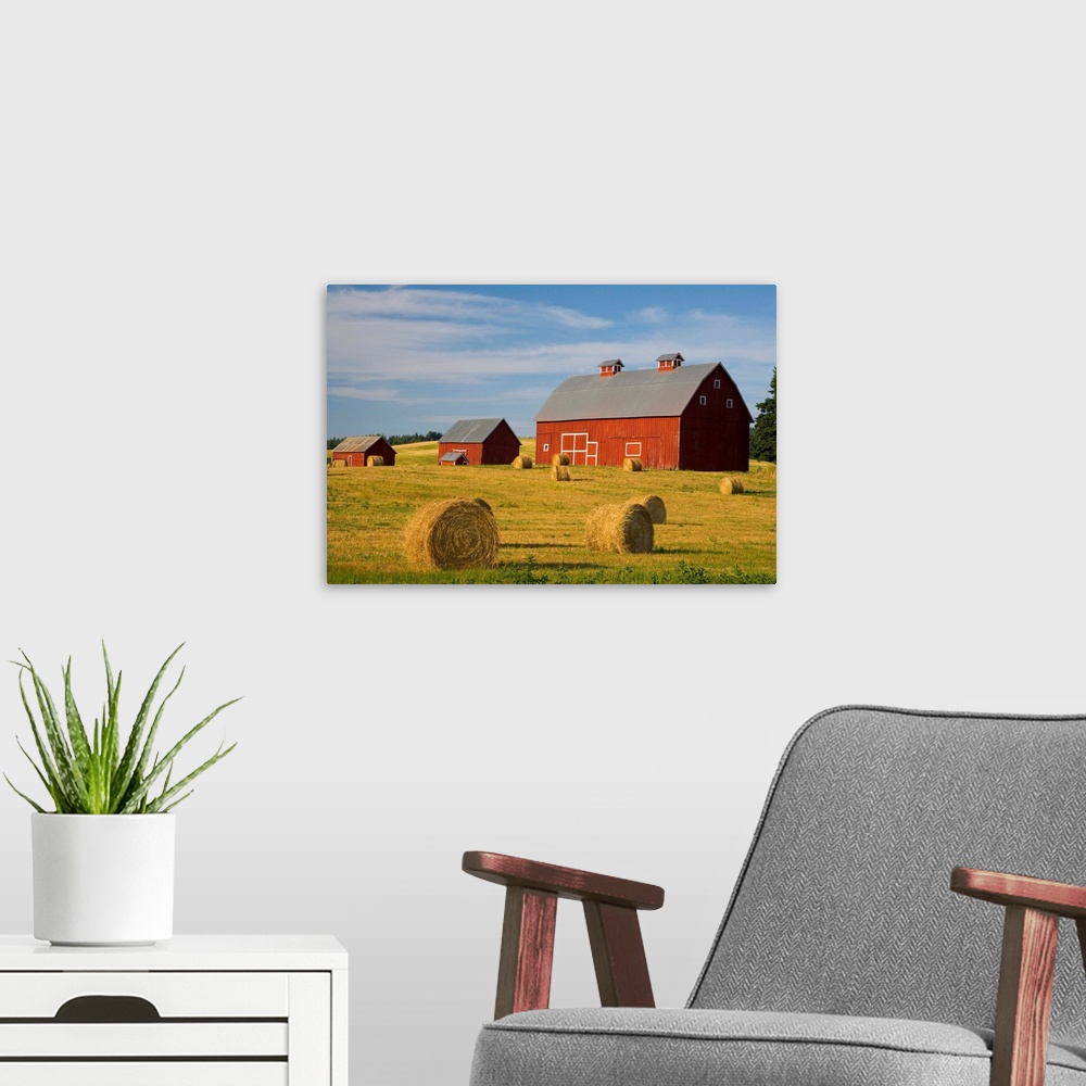 A modern room featuring Barns And Hay Bales In Field