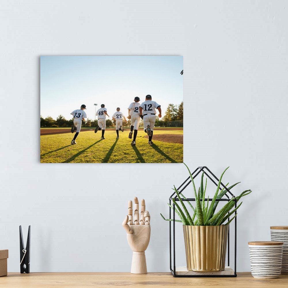 A bohemian room featuring Baseball players (10-11) running on baseball diamond