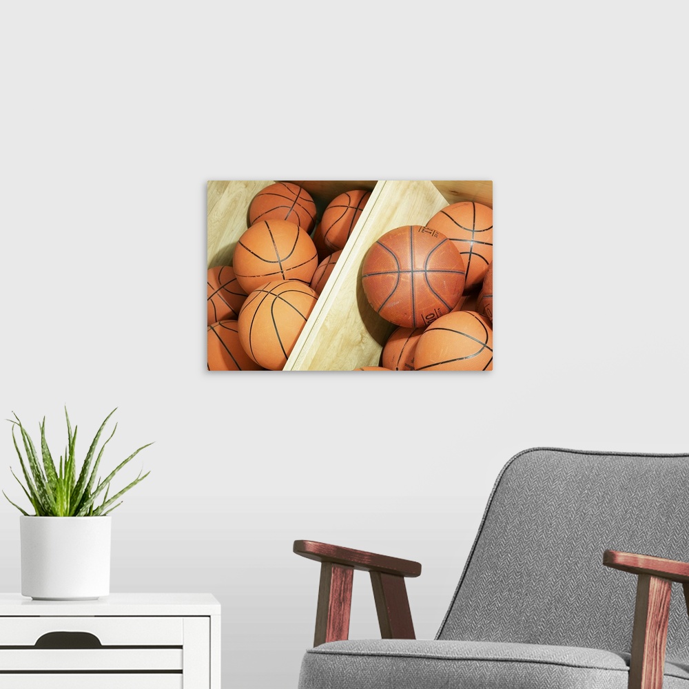A modern room featuring Basketballs in storage bin