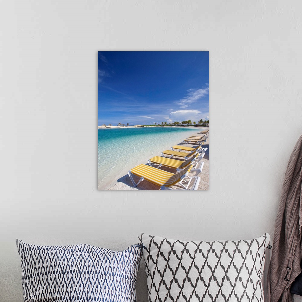 A bohemian room featuring Beach lawn chairs tropical water