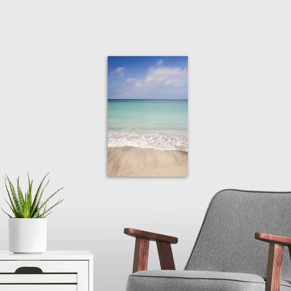 A modern room featuring Beach scene with blue sky, turquoise water and white sand.  Sarasota Florida, 2006.
