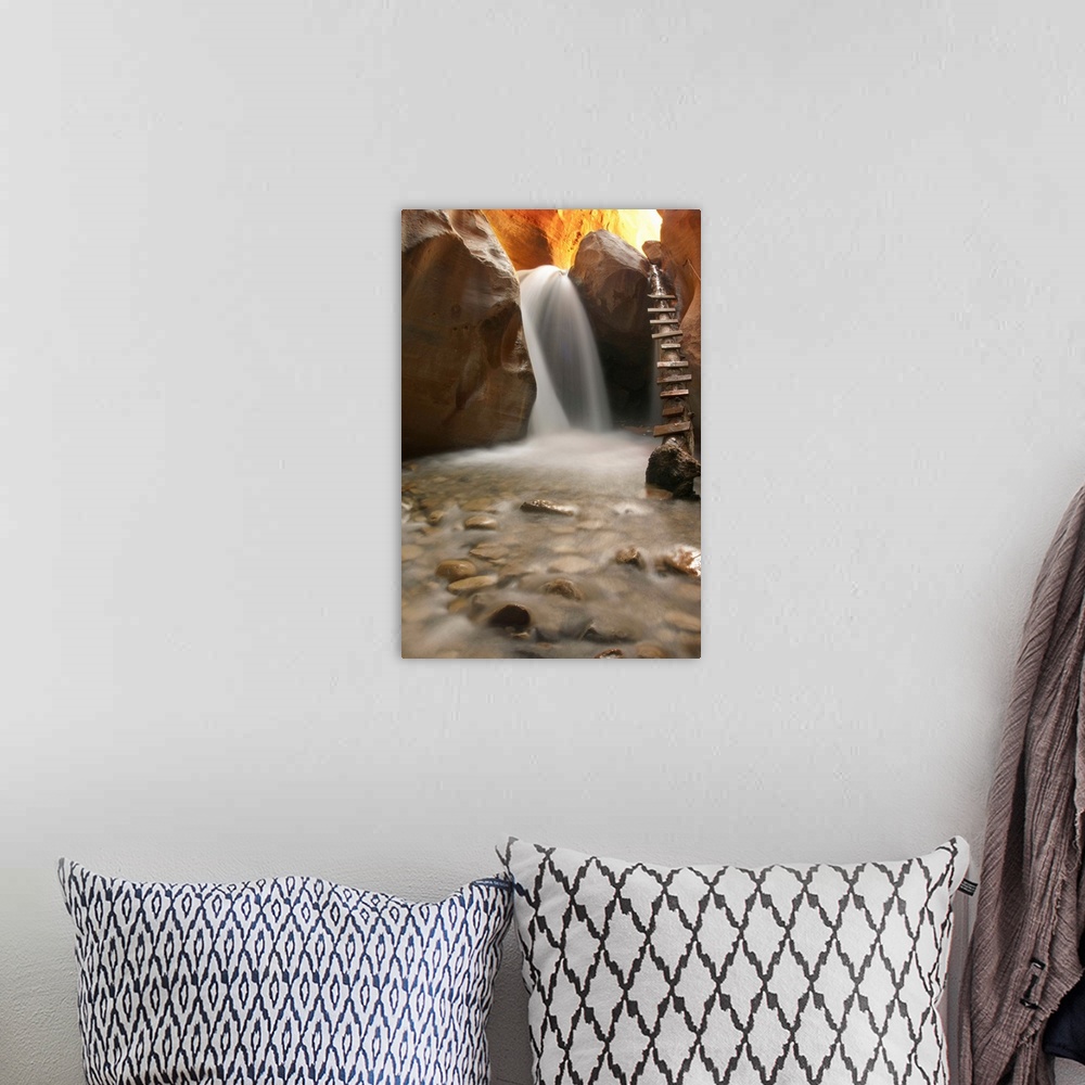 A bohemian room featuring Beautiful waterfall with pebbles on foreground.