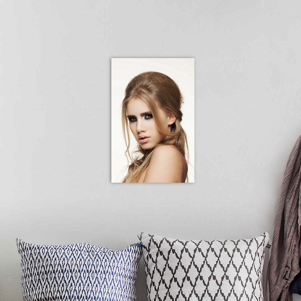 A bohemian room featuring Close-up of young female face, beauty portrait, clear skin, professional make-up.