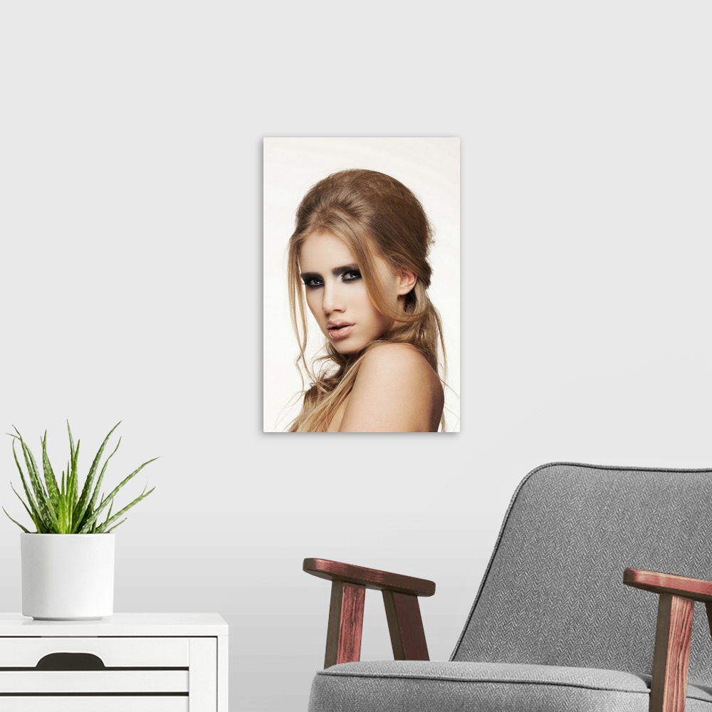 A modern room featuring Close-up of young female face, beauty portrait, clear skin, professional make-up.