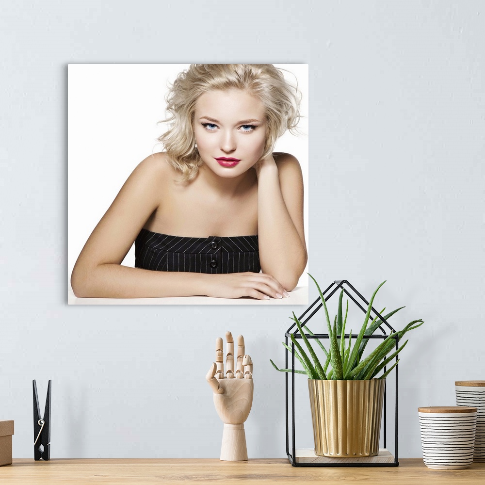 A bohemian room featuring Beauty portrait of young blonde, professional hairstyle and make-up